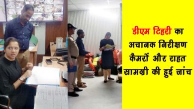 "DM Nikita Khandelwal inspecting disaster relief stock and CCTV footage at Tehri District Disaster Management Center"