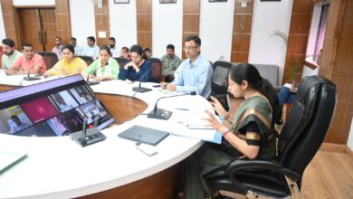 District Magistrate of Tehri reviewing GIS land bank plans in a meeting